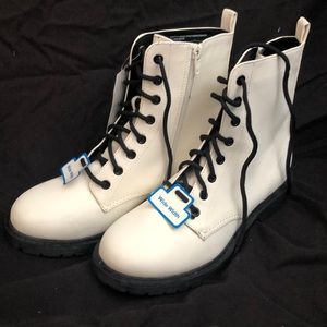 Size 8 combat boot. Never Worn. Tags still tack.
